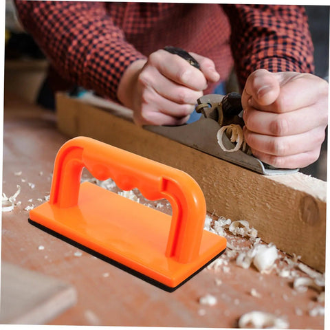Heavy Duty Woodworking Safety Push Block For Table Saw And Router Tables Badass Shop Gear in bright orange with non-slip grip, used in woodworking.