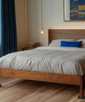 Heavy Duty Non Slip Furniture Pads For Hardwood Floors With Two Inch Round Silicone Caster Cups supporting a wooden bed frame.