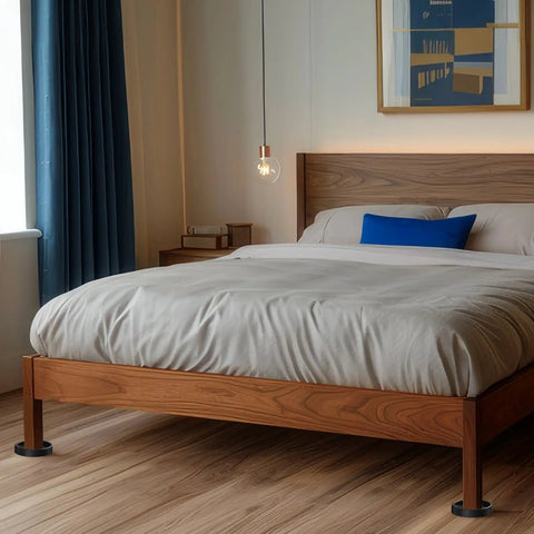 Heavy Duty Non Slip Furniture Pads For Hardwood Floors With Two Inch Round Silicone Caster Cups supporting a wooden bed frame.