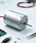 Top Shelf 24Mm RF-370CA DC Motor Goes Off At 12000RPM For Every Slick DIY Build Or Smart Lock Setup Runs Smooth On 6V To 12V With A Heavy Duty Metal Shaft on a table with electronic components.