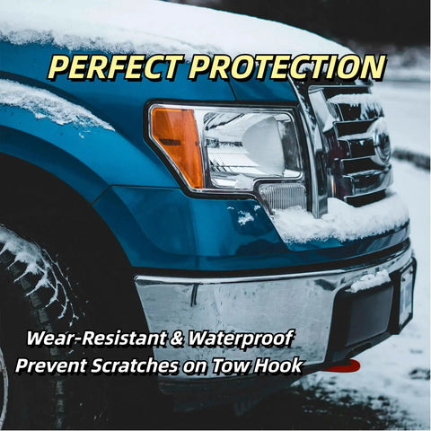 Red Tow Hook Covers For Ford F-150 2004-2024 And Toyota Tundra 2017-2021 on blue truck, front view with snow, rugged exterior trim