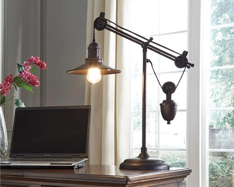 Urban Industrial 29.5 Inch Metal Desk Lamp With Adjustable Arm And Shade Bronze Finish beside laptop in home office