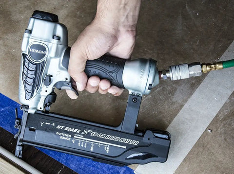 Lightweight 18 Gauge Brad Nailer With Hella Cushion Grip, 2-inch capacity, shown being held, ideal for precision trim work.