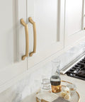 Bellamy Champagne Bronze Cabinet Pull 3-3/4 Inch Center To Center Mounting installed on kitchen cabinets