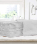 Pack Of 50 Reusable Cotton Rags For Home Garage And Car Detailing Durable Soft 13 By 13 Inch White Towels That Wash Easy And All Purpose Cleaning Cloths For Workbench Kitchen Automotive And Workshop Use stacked on table