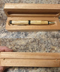 Wooden case with a pen showcasing mini brass barrel hinges hidden concealed for keepsake boxes and small cabinets, top view.