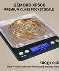 Platinum XP500 Pro Grade Jeweler Pocket Scale with gold chains on platform, 500g capacity, 0.01g precision, LCD display, silver finish.
