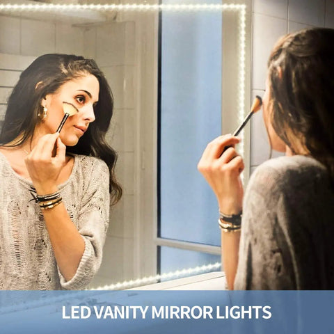Woman applying makeup with 65.6ft Warm White LED Strip Lights Kit With Dimmable 24V Power Supply on vanity mirror reflecting light