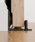 Adjustable Sliding Barn Door Floor Guide With Rock Solid Heavy Duty Metal Base And Double Nylon Quiet Rollers For A Smooth As Butter Glide On Any Interior Door Frame In Sleek Black overview showing equipment mounted on the floor.