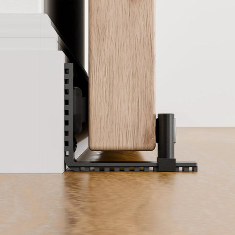 Adjustable Sliding Barn Door Floor Guide With Rock Solid Heavy Duty Metal Base And Double Nylon Quiet Rollers For A Smooth As Butter Glide On Any Interior Door Frame In Sleek Black overview showing equipment mounted on the floor.