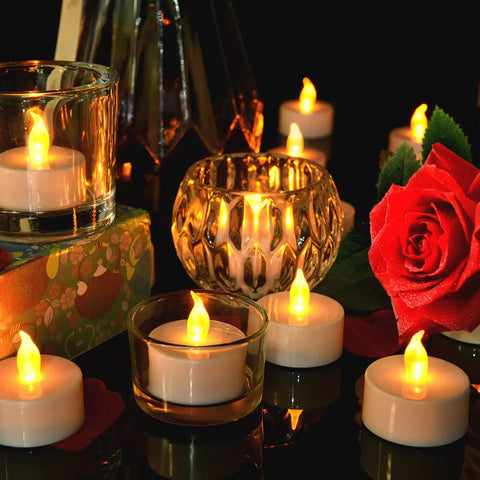 Flameless Tea Light Candles 50 Pack With Batteries Included Realistic Flickering LED Tealights in glass holders with a red rose