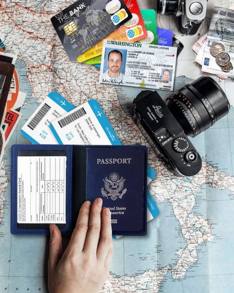 Person holding RFID Blocking Passport Wallet With Card Slots And Document Organizer on map with travel items
