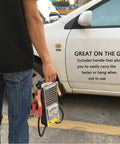 Battery Load Tester For 6V And 12V Vehicles With Voltmeter And Alligator Clips, handheld with clamps by a car