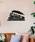 Locomotive Metal Wall Art In Matte Black For Living Room Office Or Bar A Vintage Rustic Sign And Industrial Decor That Pops Durable Metal Sculpture For Indoor Or Outdoor Use 16 Inch, displayed on a wall above a couch.