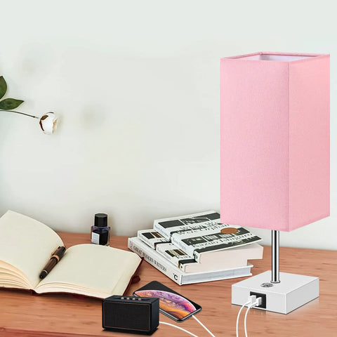 Pink Touch Control Table Lamp With 3 Way Dimmable Brightness And USB A And USB C Ports, White Base, on wooden nightstand