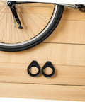 Heavy Duty 39mm Front Fork Turn Signal Mounting Brackets 2 Pack Clamp For Motorcycle Signal Lights next to bicycle wheel on wood