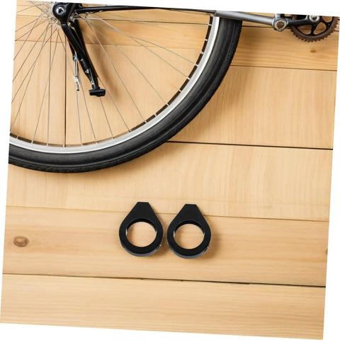 Heavy Duty 39mm Front Fork Turn Signal Mounting Brackets 2 Pack Clamp For Motorcycle Signal Lights next to bicycle wheel on wood