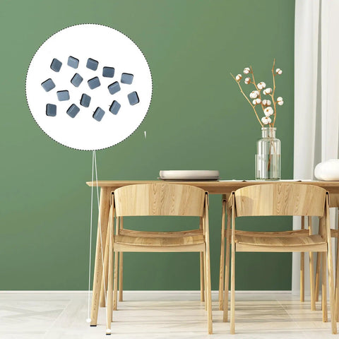 16 Pack Chair Leg Floor Protectors With PTFE Glide Pads shown on chairs near a wooden dining table, green wall background