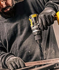 Close-up of cordless drill with Meccion masonry drill bits set, 5 pcs, 1/8 in x 3.6 in, tungsten cross-tip.