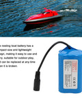Massive 12000mAh 7.4 Volt Rechargeable Lithium Battery For RC Fishing Bait Boats next to a red RC boat on water