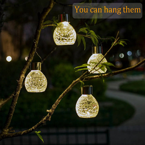 4 Pack Solar Lanterns With Shepherd Hooks No Wiring Easy Setup Outdoor Color Changing Crackle Glass 3 Lumens Waterproof Garden Lights For Pathway Backyard Decor hanging on a tree