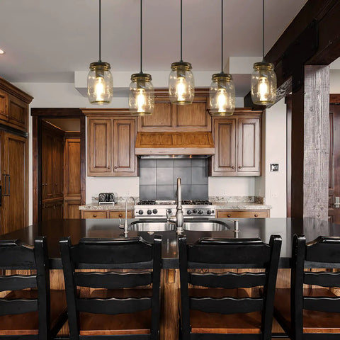 Five Light Mason Jar Pendant Lighting Fixture Black Rustic Farmhouse Chandelier hanging over a kitchen island with chairs