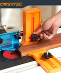 Heavy Hitter Table Saw Push Block And Push Stick Kit Featuring Stackable Feather Board in use with router table and wood.