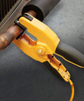 Yellow pipe clamp K-type thermocouple adapter attached to copper pipe for HVAC temperature readings