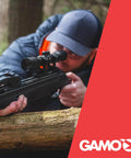 Swarm Whisper 22 Caliber Air Rifle With 10 Shot Repeater And IGT Gas Piston used for target practice in forest setting