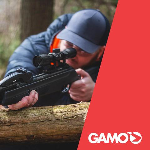 Swarm Whisper 22 Caliber Air Rifle With 10 Shot Repeater And IGT Gas Piston used for target practice in forest setting