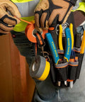 Tradesman Pro Maintenance Tool Pouch With Nine Pockets And Tape Thong 2 Inch Tunnel Belt Loop Electrician Holster worn on waist.