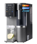 Mineral Rich A2G Countertop Reverse Osmosis System With Hot And Cold Water On Tap dispensing water into a glass with lemon slice