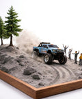 Mini RC Truck 1/64 Scale Alloy Monster Truck With Lights climbing a rocky slope with spectators cheering nearby