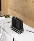 28 Piece Steel Punch Set with Single Hole Puncher for Mechanical Repair and DIY Projects on a workshop table