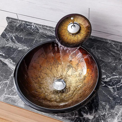 Slick Tempered Glass Bathroom Vessel Sink With Hardcore Waterfall Faucet Premium Countertop Wash Basin on marble surface.