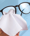 Eyeglass cleaning cloth, white microfiber, 5x6 inch; front view with black-framed glasses