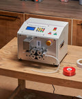Automatic Heat Shrink Tube Cutter With Lcd Display Heavy Duty Pvc Pe Silicone Pipe Trimmer on wooden table for cutting tubes.