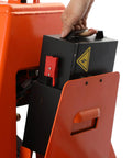 Hand removing lithium battery from Heavy Duty 3300 Lbs Electric Pallet Jack With Removable Lithium Battery, Fast Charging 24V 20Ah Power Pack.