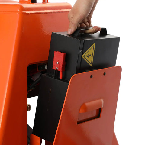 Hand removing lithium battery from Heavy Duty 3300 Lbs Electric Pallet Jack With Removable Lithium Battery, Fast Charging 24V 20Ah Power Pack.