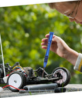 Child using RC Car Repair Tool Kit With Wrench, Screw And Fastener Set, Nut And Bolt Assortment, Durable Iron Tools on RC vehicle