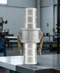 Heavy Duty Six Inch Female Cam Lock Coupling Machined From Rugged Aluminum Alloy With Quick Release Design on a workbench.
