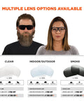 Two people wearing Skullerz Skoll Safety Glasses, showcasing lens options: clear, indoor/outdoor, smoke.