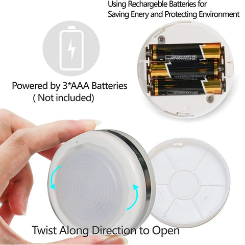 Hand holding Led Puck Lights With Remote Control No Wires Needed Stick On Under Cabinet Lights AAA Battery Powered With Auto Off 30 Minute Timer Six LEDs, showing battery compartment open for AAA batteries.