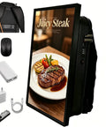 Rugged 21.5 Inch Digital Ad Board Backpack With Ultra Bright 600 Nits Hd Lcd Screen On Android Os And Beefy 30000 Mah Power Bank next to steak dish.