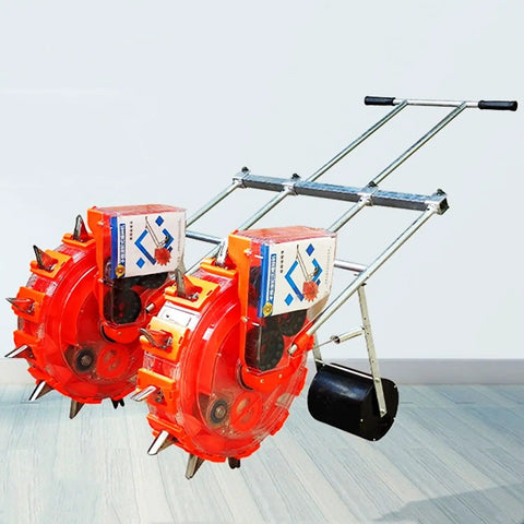 Hand Seed Spreader And Fertilizer Applicator, Double Row Manual Seeder with roller drive, metal frame in garden setting