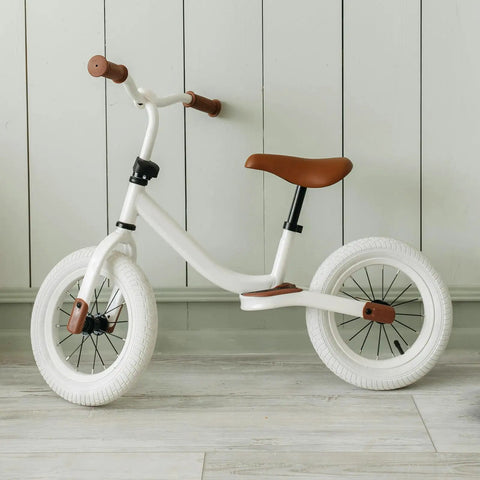White balance bike with brown seat and grips for kids, perfect for use with Tough As Nails Bike Inner Tube Replacement 12 1/2 X 2 1/4