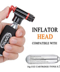 Hand holding CO2 Inflator Kit With Five 16g CO2 Cartridges Presta And Schrader Valve Compatible Portable Bike Tire Pump