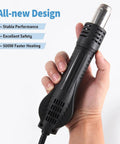 Hand holding 858D Hot Air SMD Rework Station with Digital Soldering Heat Gun, showcasing design features.
