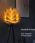 Boho Lotus Flower Floor Lamp With Tripod Stand, Cozy Glow And Chill Vibe in a dark room, glowing softly with black finish tripod