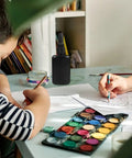 Get These Epic Glue Dispensing Bottles With Precision Nozzle Caps In Sleek Black, perfect for DIY crafts on a workspace.